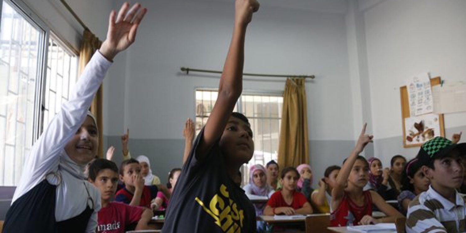 Syrian refugee children attend a class in Chekka, northern Lebanon